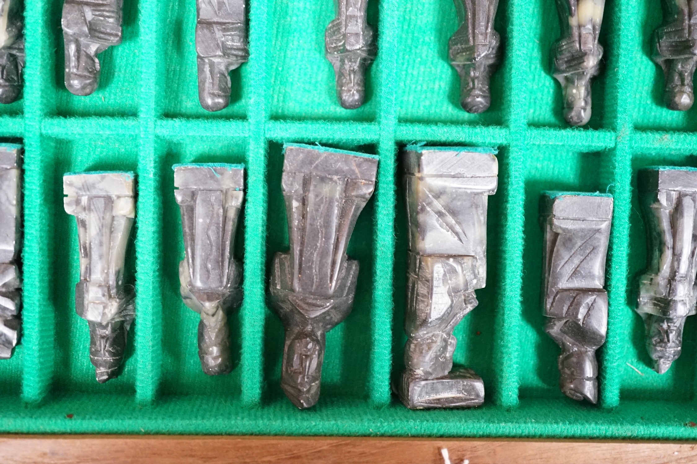 A chess board, with carved soapstone chess pieces